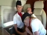 Two flight attendents suck a guys cock