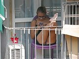 Teen neighbor shows upskirt on the balcony III