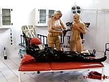 Rubber clinic medical restrained plinth fuck piss
