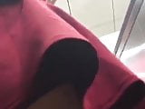Asian Babe escalator upskirt wearing gym shorts underneath