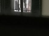 Neighbor window changing girlfriends ass