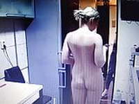 Naked woman doing clean at home